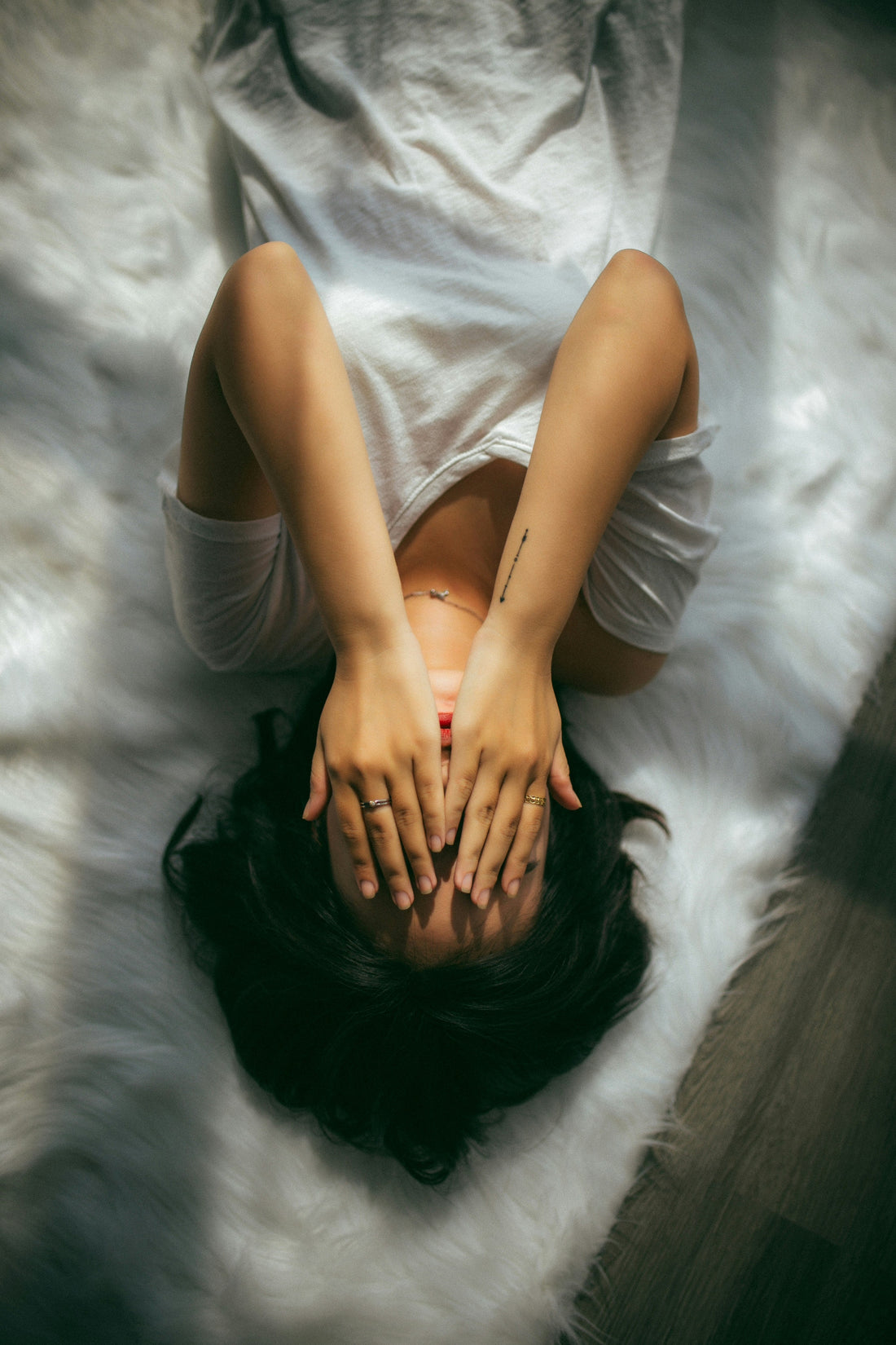 Woman in soft natural light gazing thoughtfully — brain fog during perimenopause